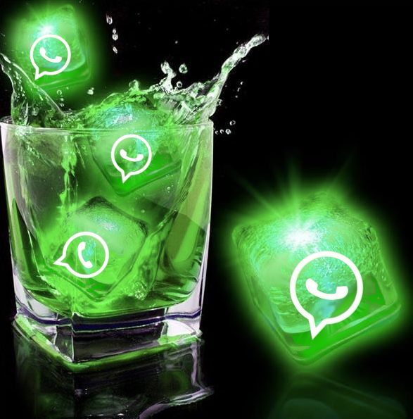 Glowing green ice cubes with the WhatsApp logo splashing into a glass